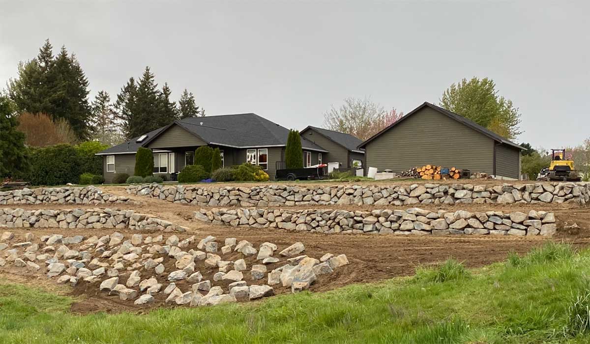 new home with rock wall